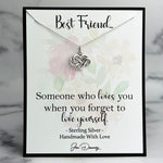 Necklace with heart and infinity symbol on a floral card with text